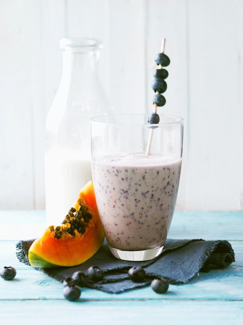 Papaya and blueberry shake with almond mousse and walnut oil