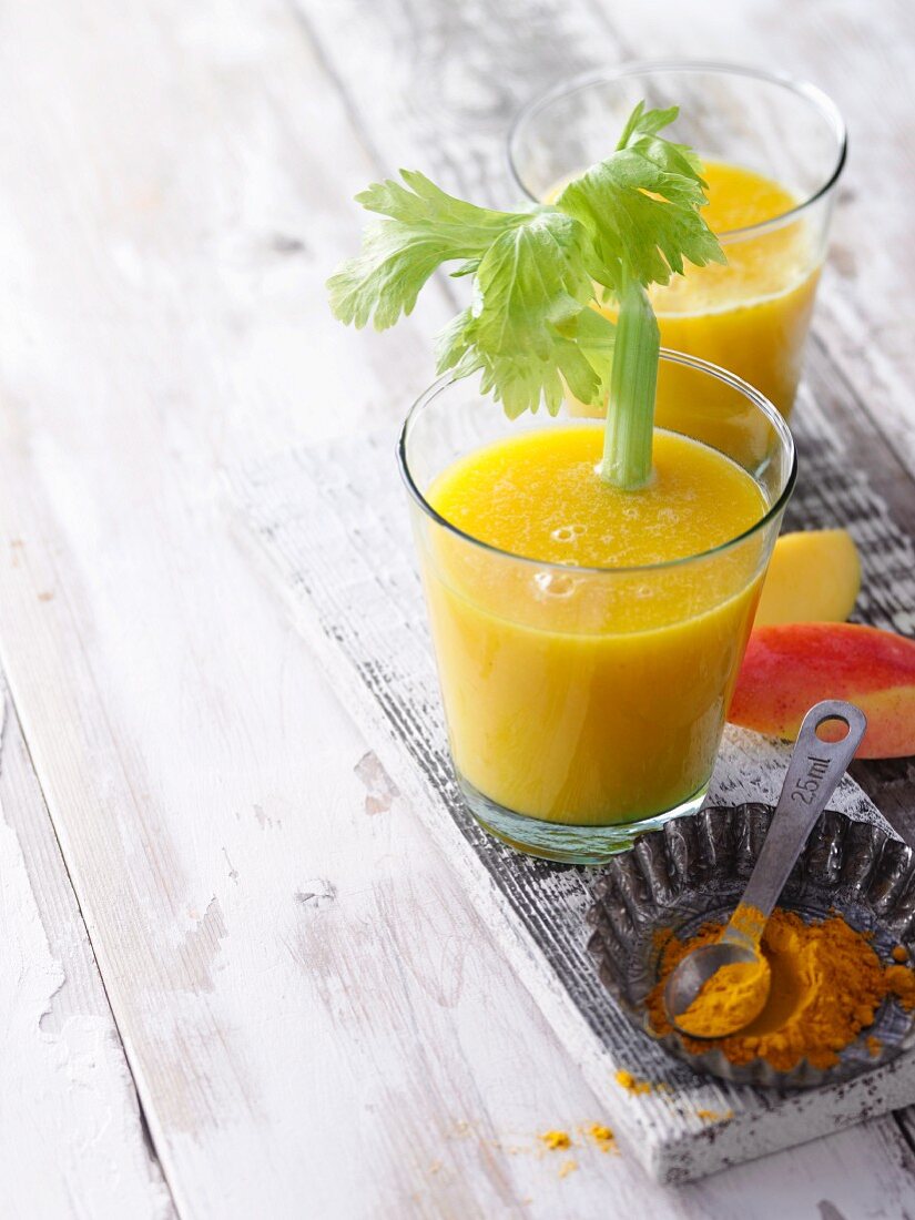 Pineapple and mango shake with celery and turmeric