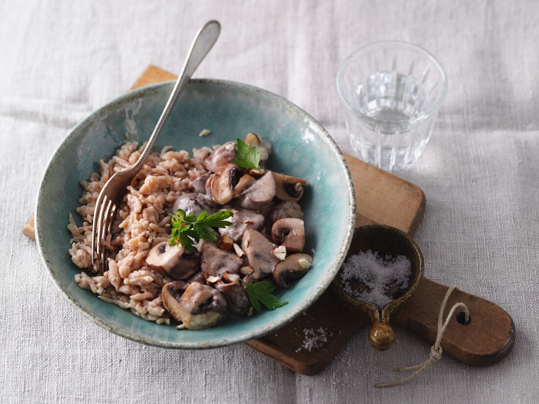 Spätzle (soft egg noodles from Swabia) with mushrooms and hazelnuts