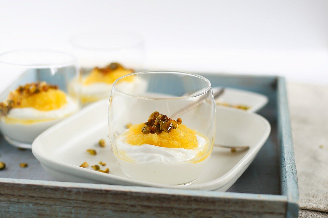 Yoghurt with mango and pistachio nuts