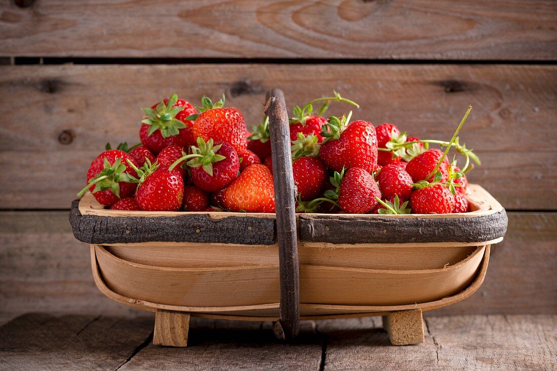 Fresh strawberries in a wooden basket