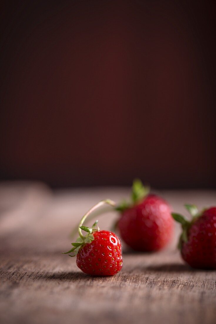 Strawberries on a wooden surface