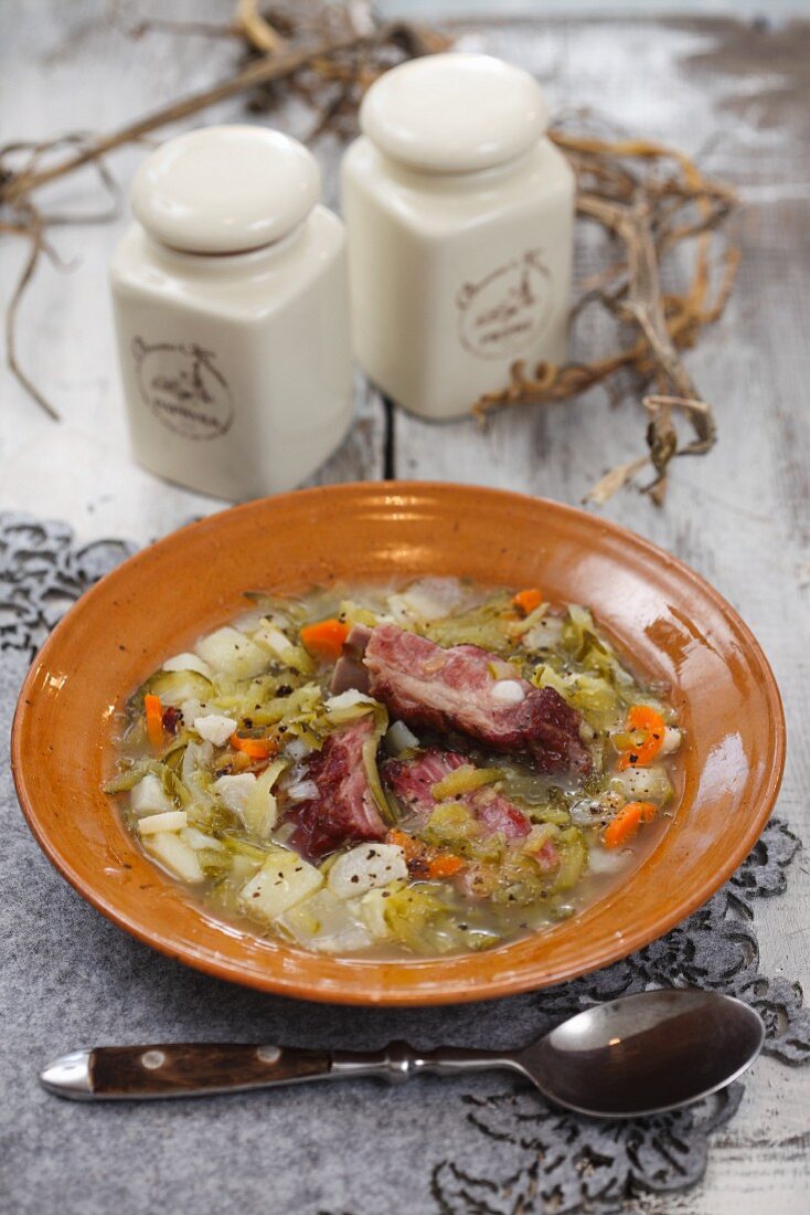 Winter vegetable stew with gherkins and bacon
