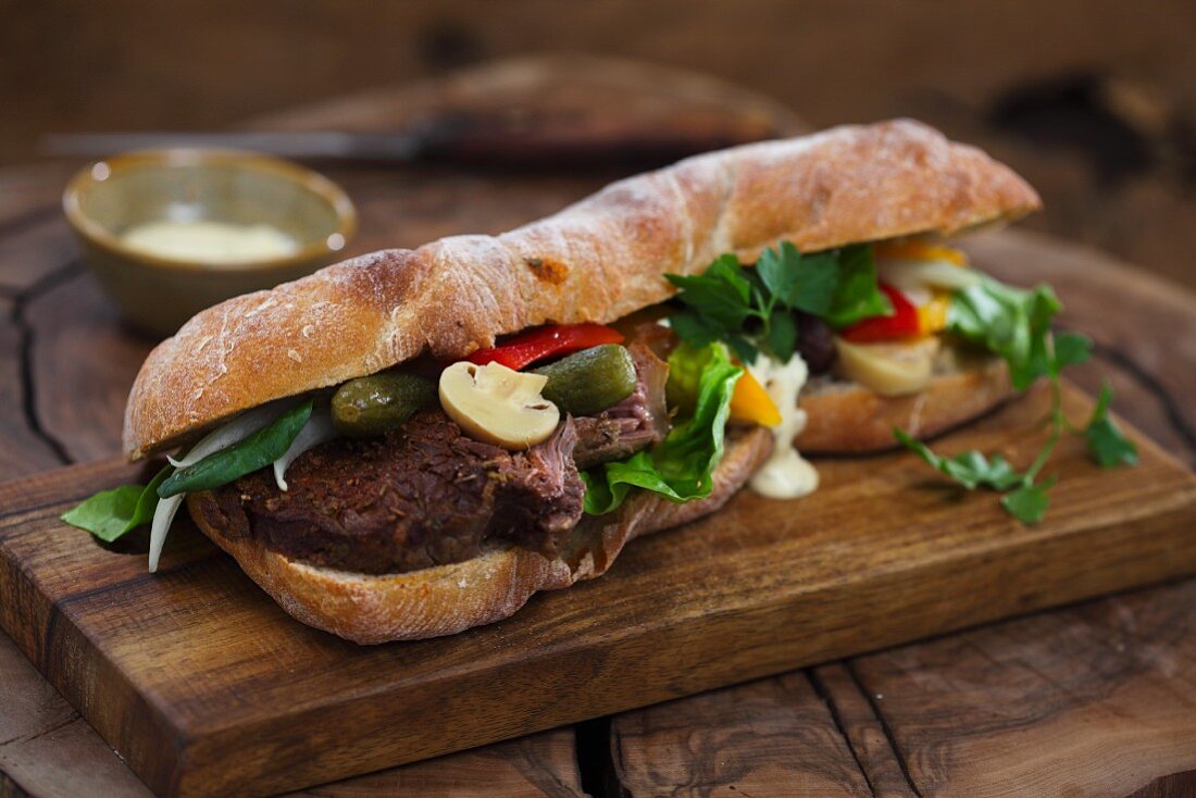 Baguette sandwich with beef and mixed pickles