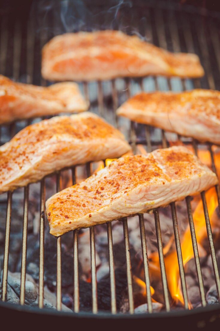 Spiced salmon fillet on a grill