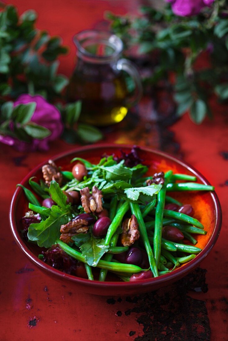 Green bean salad with rocket, olives and walnuts