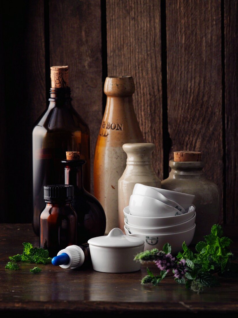 An arrangement of crucibles, glasses and bottles