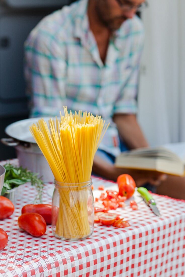 Spaghetti and tomatoes on a table