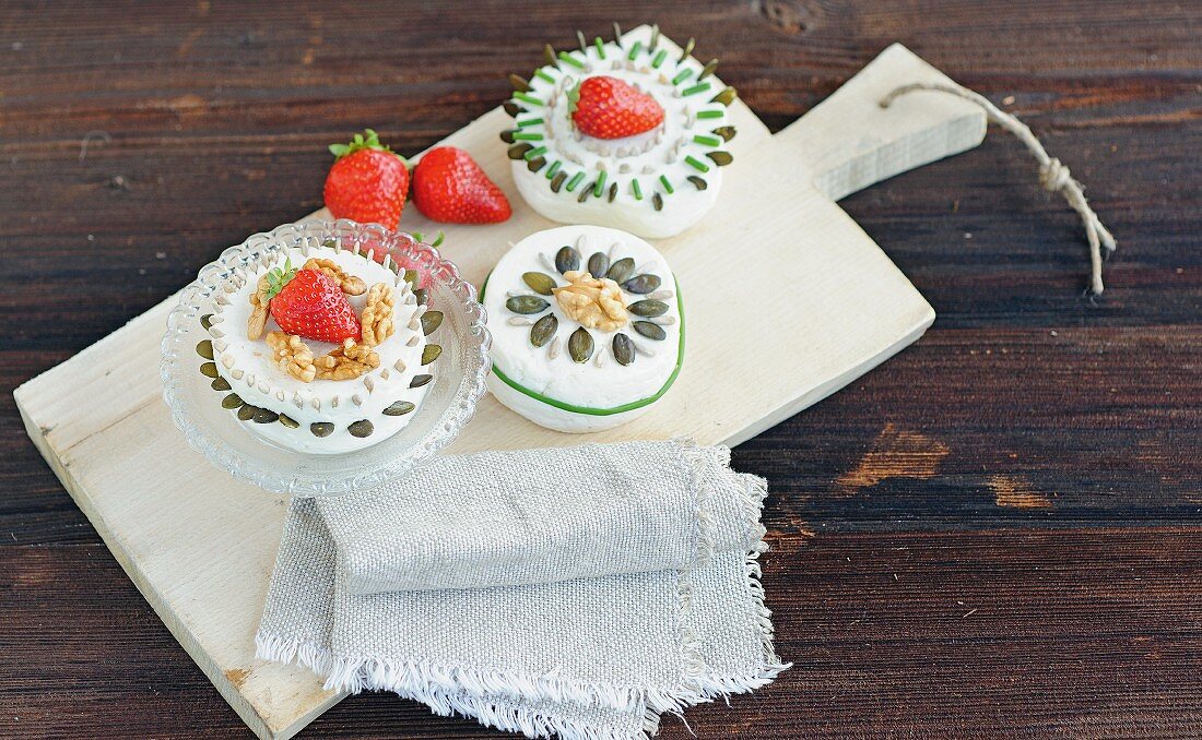 Goat's cream cheese with various seeds, chives and strawberries