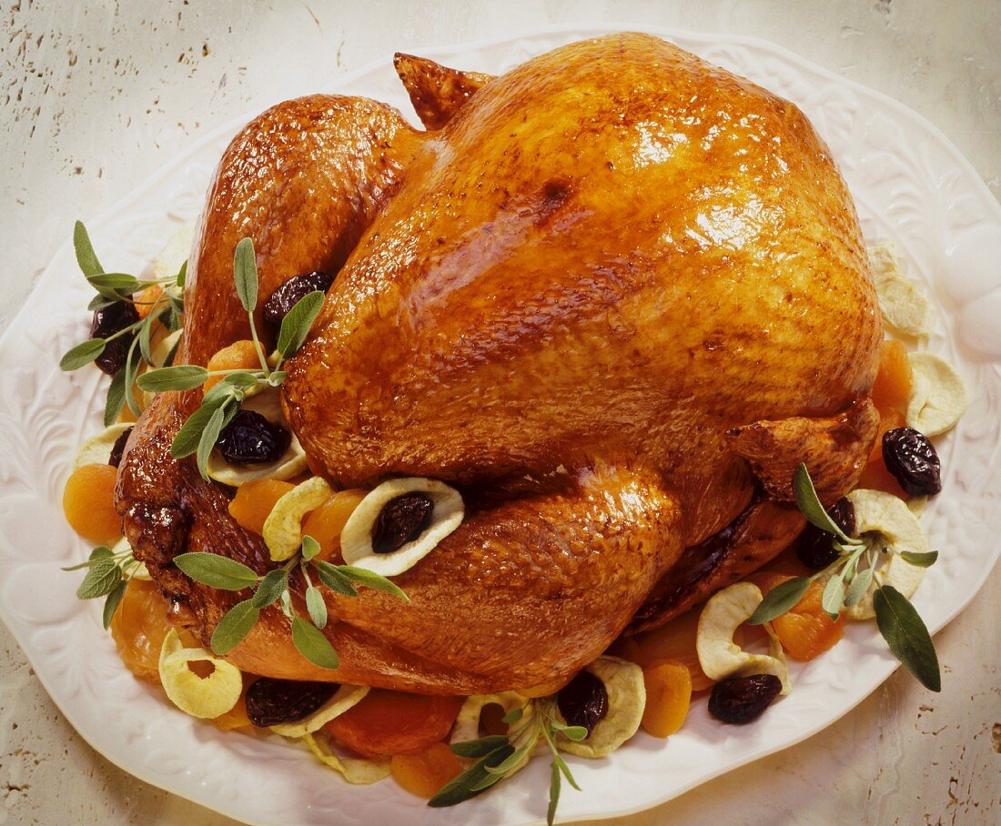 Festive roast turkey with dried fruits and sage