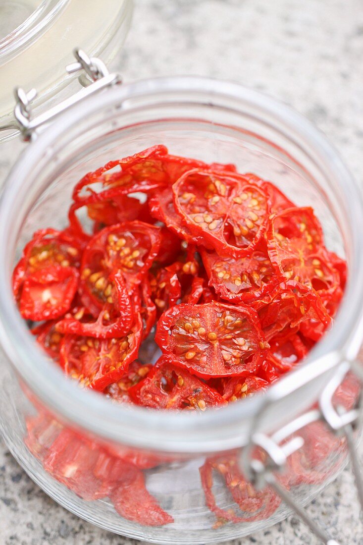 Sun-dried cherry tomatoes in preserving jar