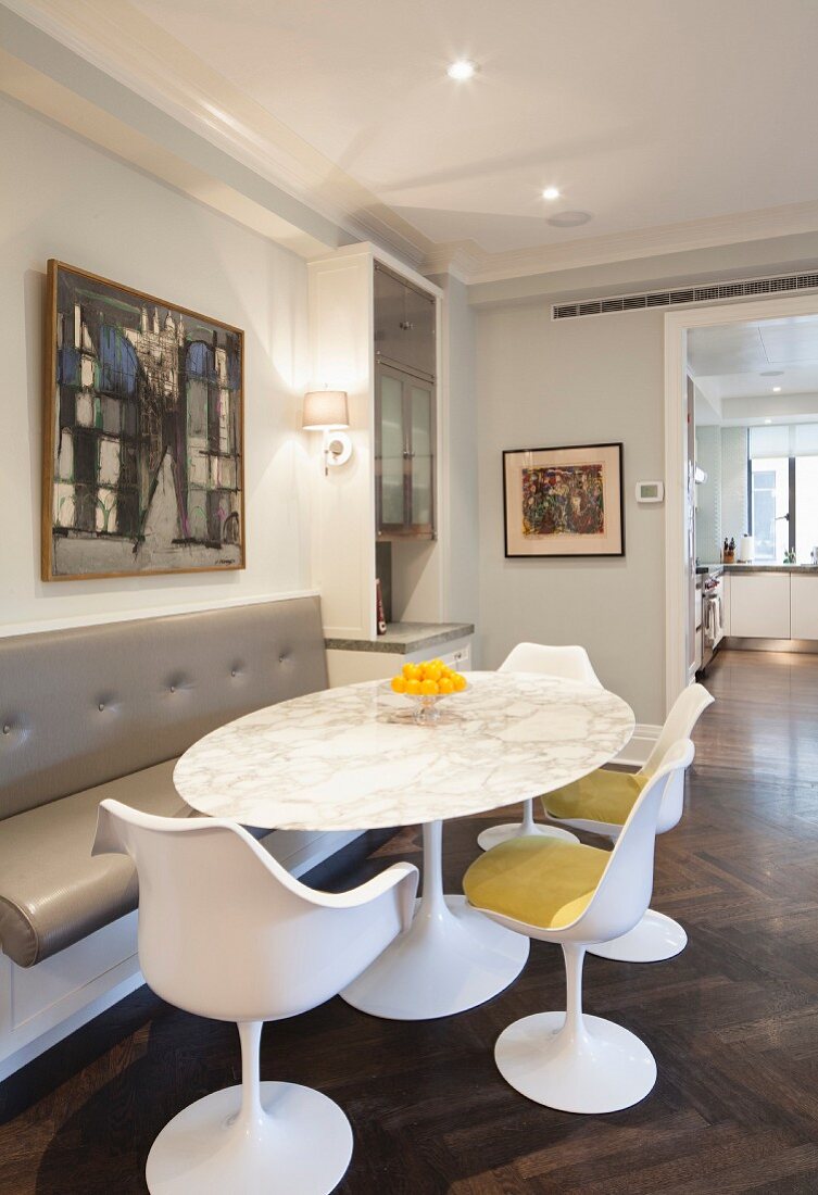 Dining table with marble top, bench and designer chairs