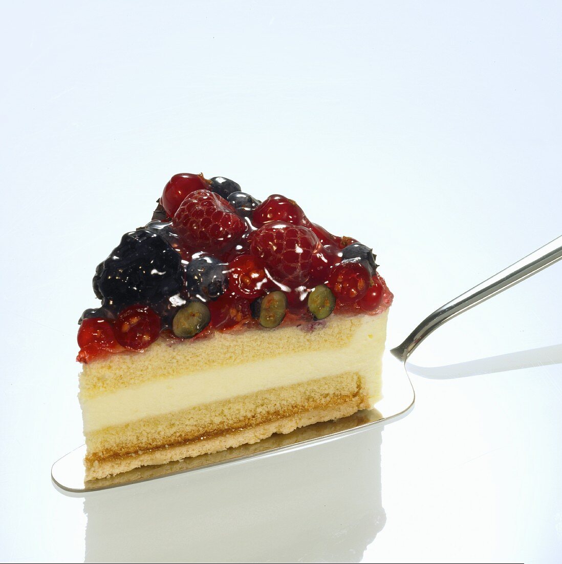 A slice of wild berry cake on a cake slice