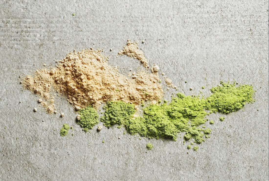 A pile of maca powder and barley sprouts powder (seen from above)