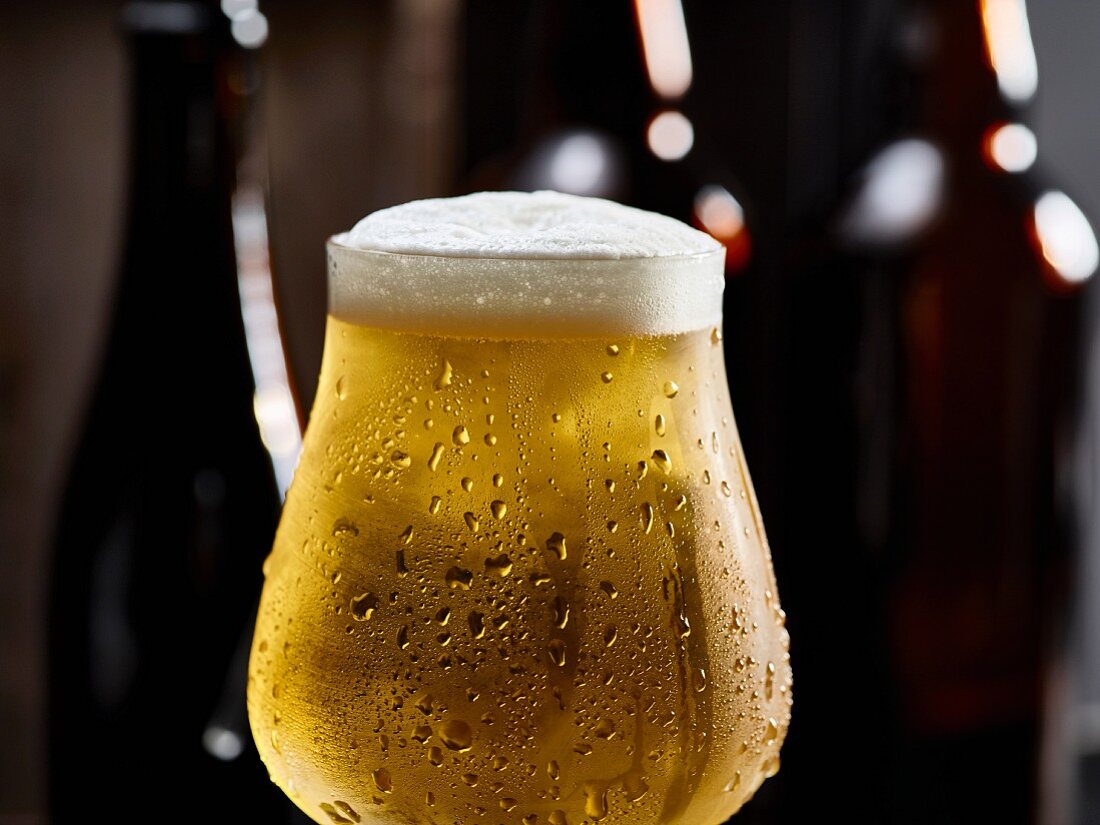 A glass of cold beer with condensation