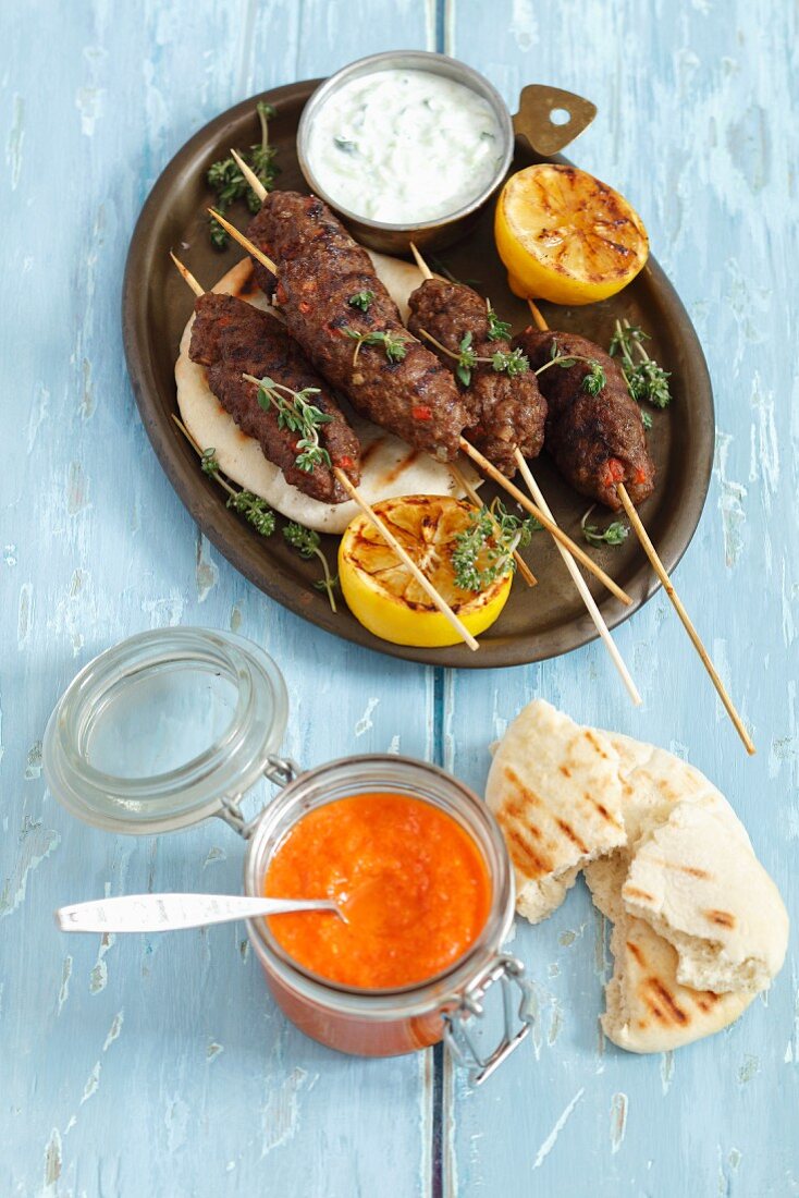 Cevapcici (mined lamb kebabs) with pita bread and ajvar