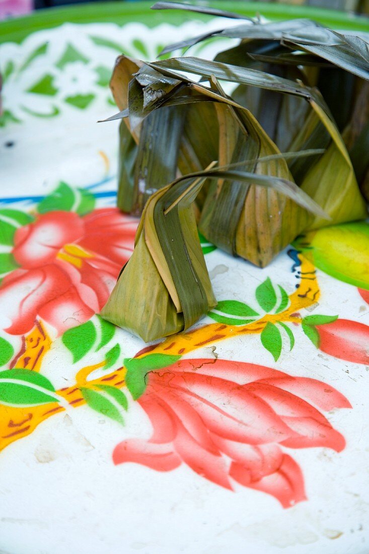 Thai dessert parcels made from banana leaves