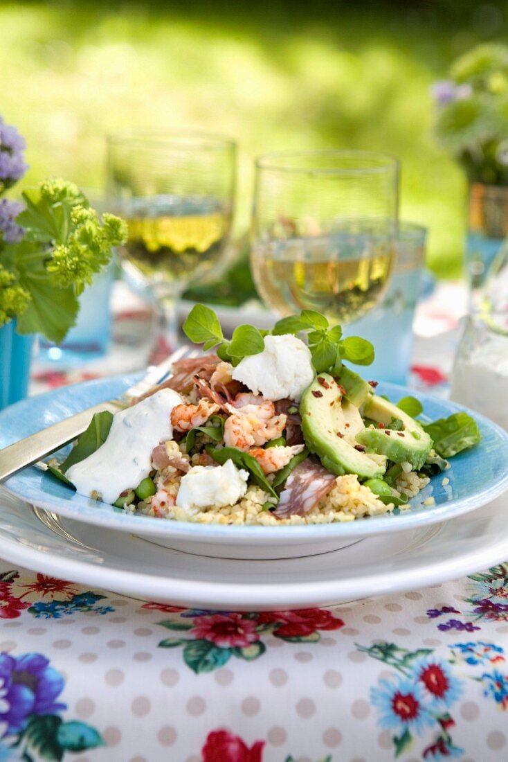 Couscous salad with scampi, salami and avocado