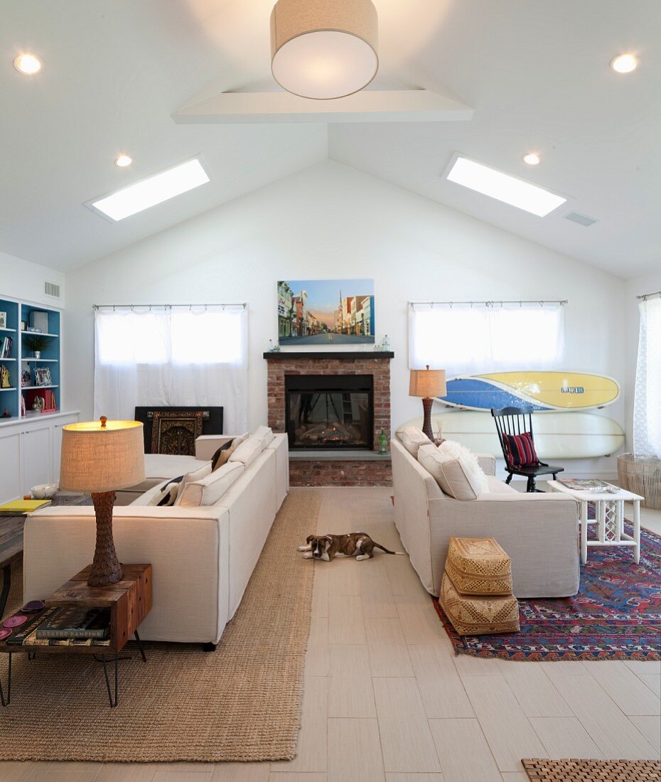 Back-to-back sofas in living room with gable ceiling