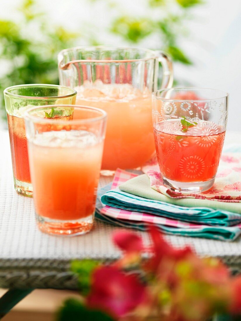 Glasses of fresh, homemade fruit juice with ice