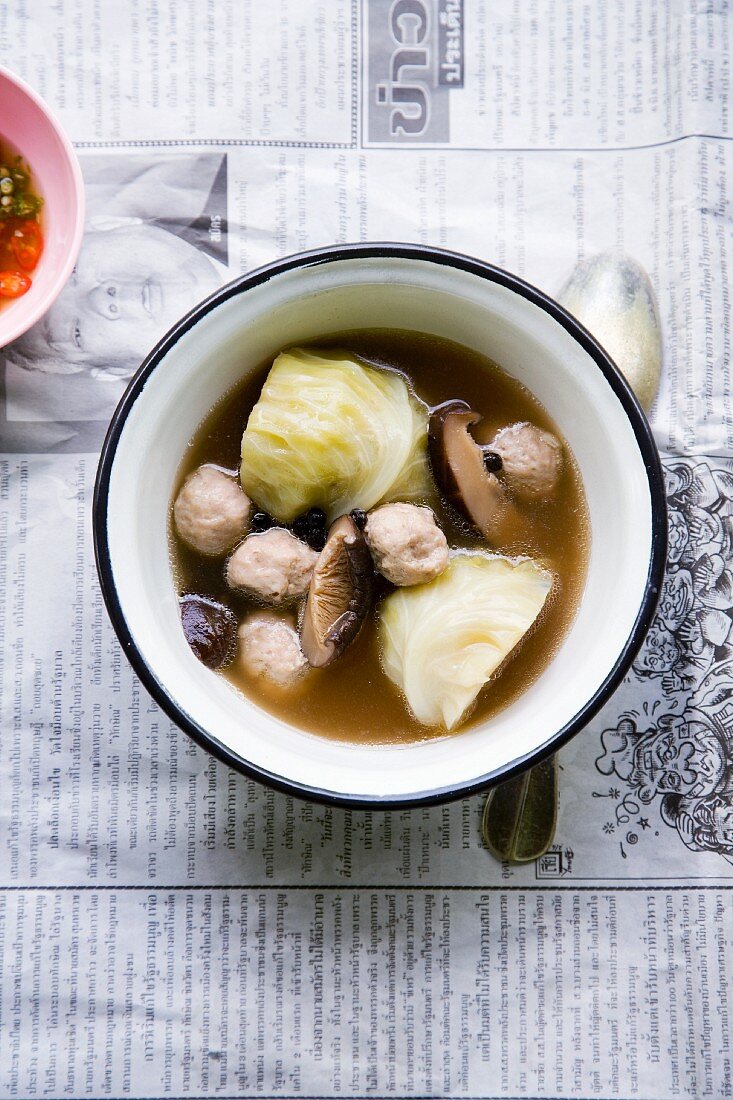Thai soup with white cabbage, shiitake mushrooms and meat dumplings