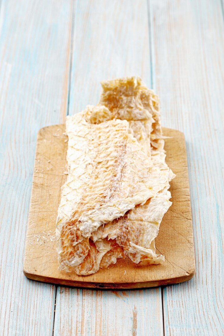 Icelandic dried fish on a wooden board