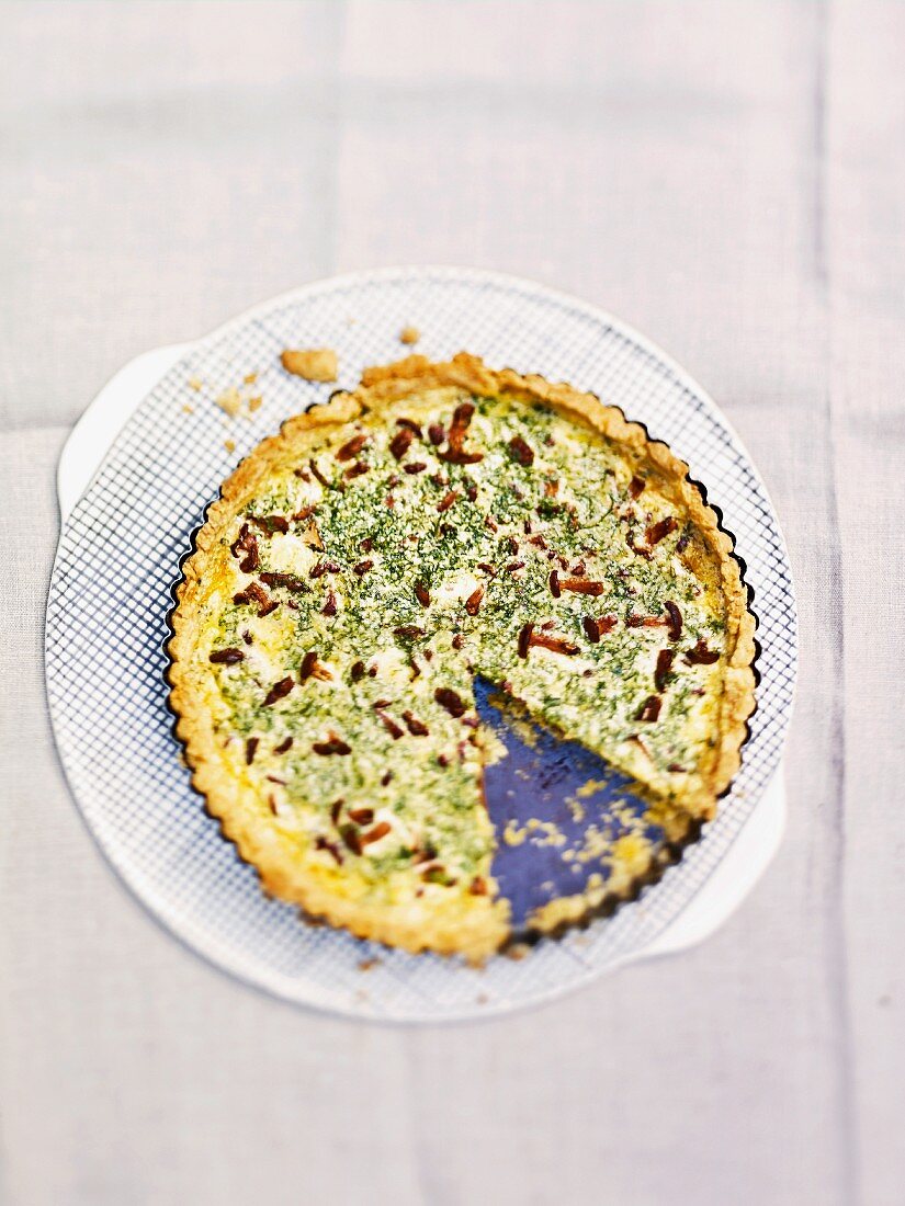 Herb quiche with mushrooms, sliced