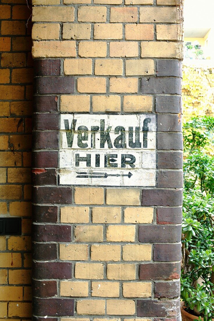 Old painted sign on brick façade