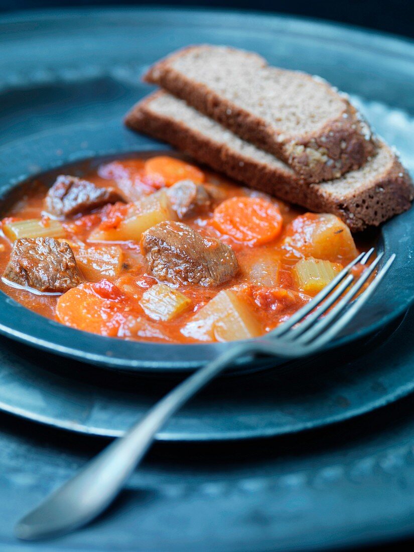 Navarin (braised lamb, France) with vegetables and bread