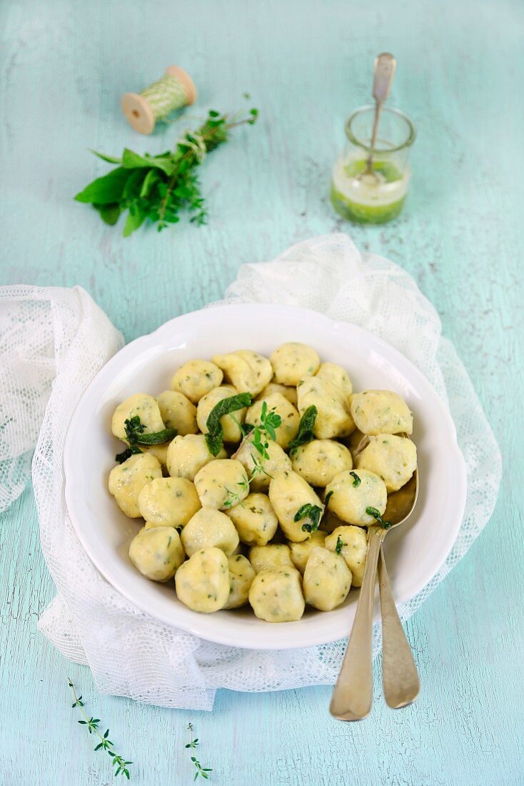 Herb gnocchi in a bowl with a spoon