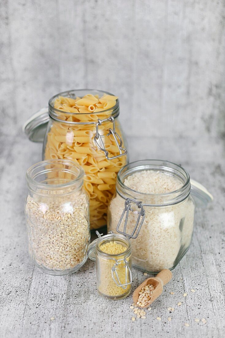 Pasta, rice and grains in storage jars