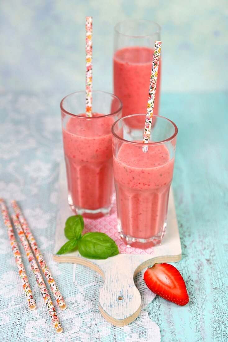 Yoghurt and strawberry smoothies with basil