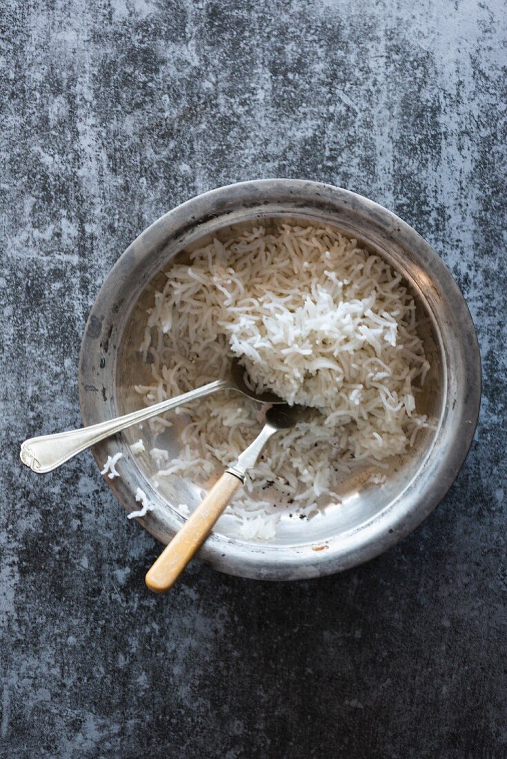 A bowl of basmati rice with cutlery