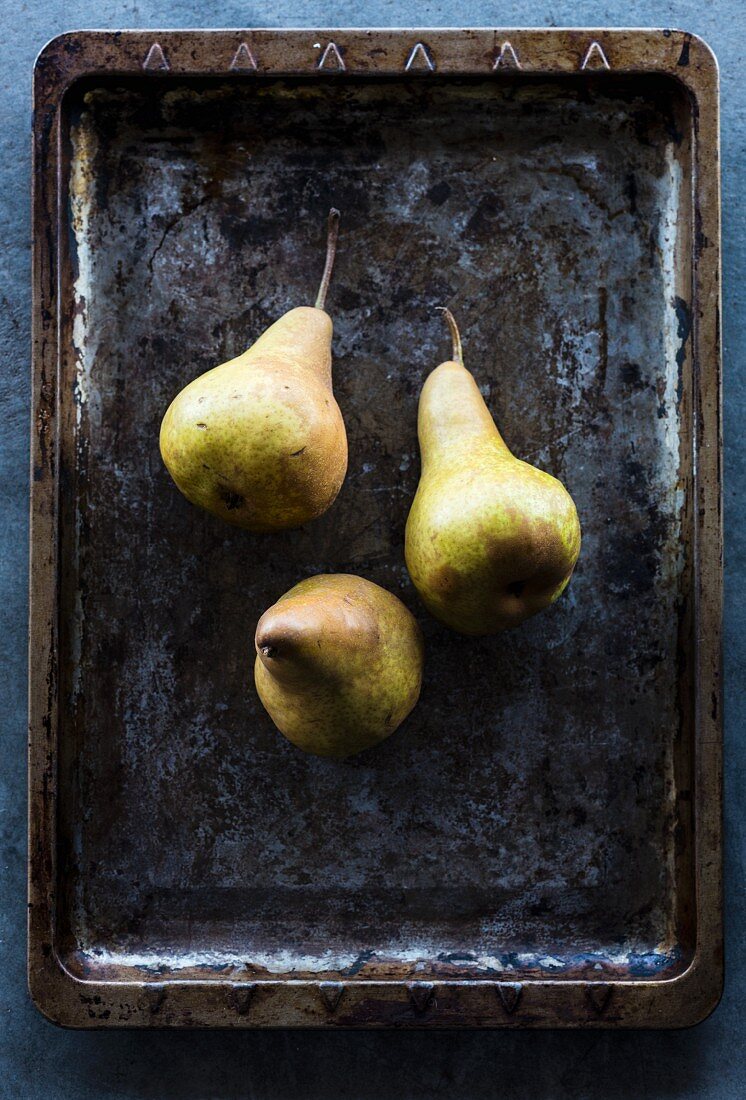 Three pears on and old baking tray