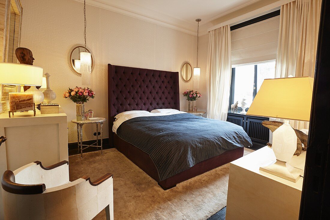 Bed with dark brown, button-tufted headboard in elegant bedroom