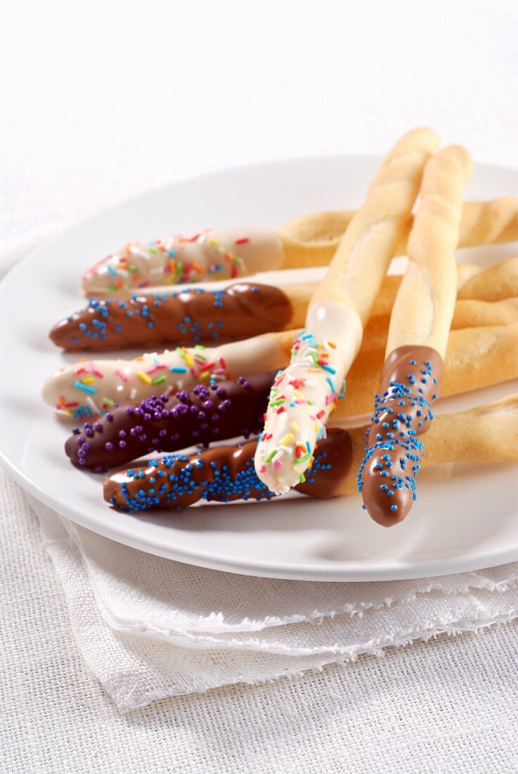 Breadsticks with chocolate glaze and sugar sprinkles