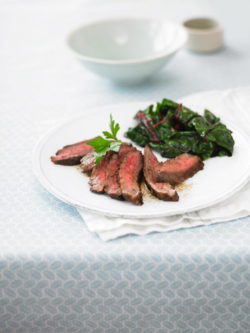 Flank steak with leafy greens