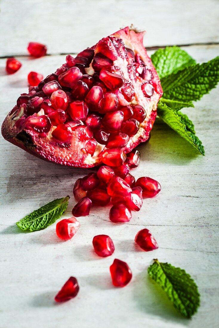 A piece of pomegranate and fresh mint