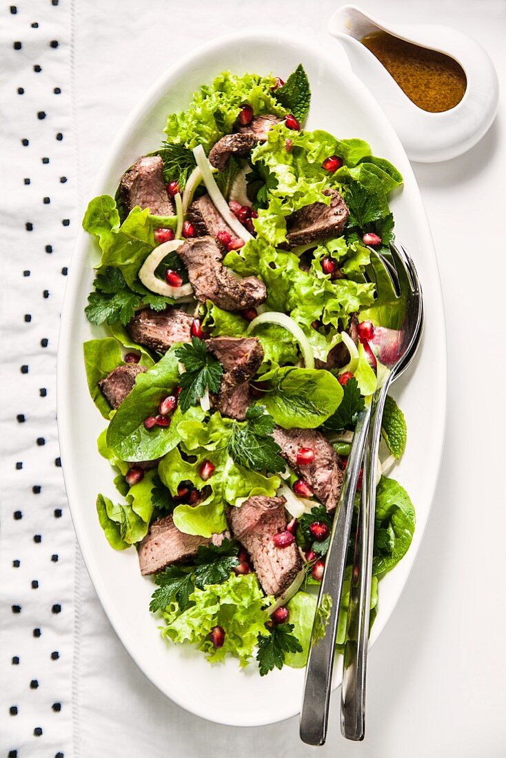 Venison and fennel salad with pomegranate seeds