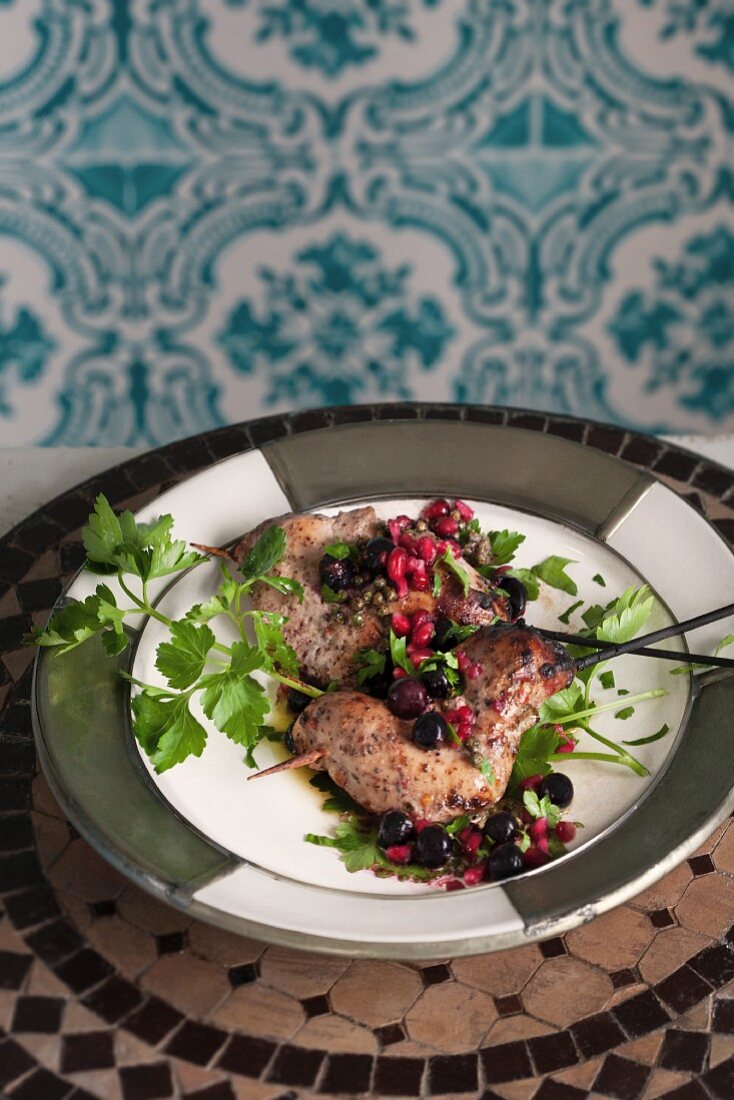 Grilled chicken with blackcurrants, pomegranate seeds and green pepper (Morocco)