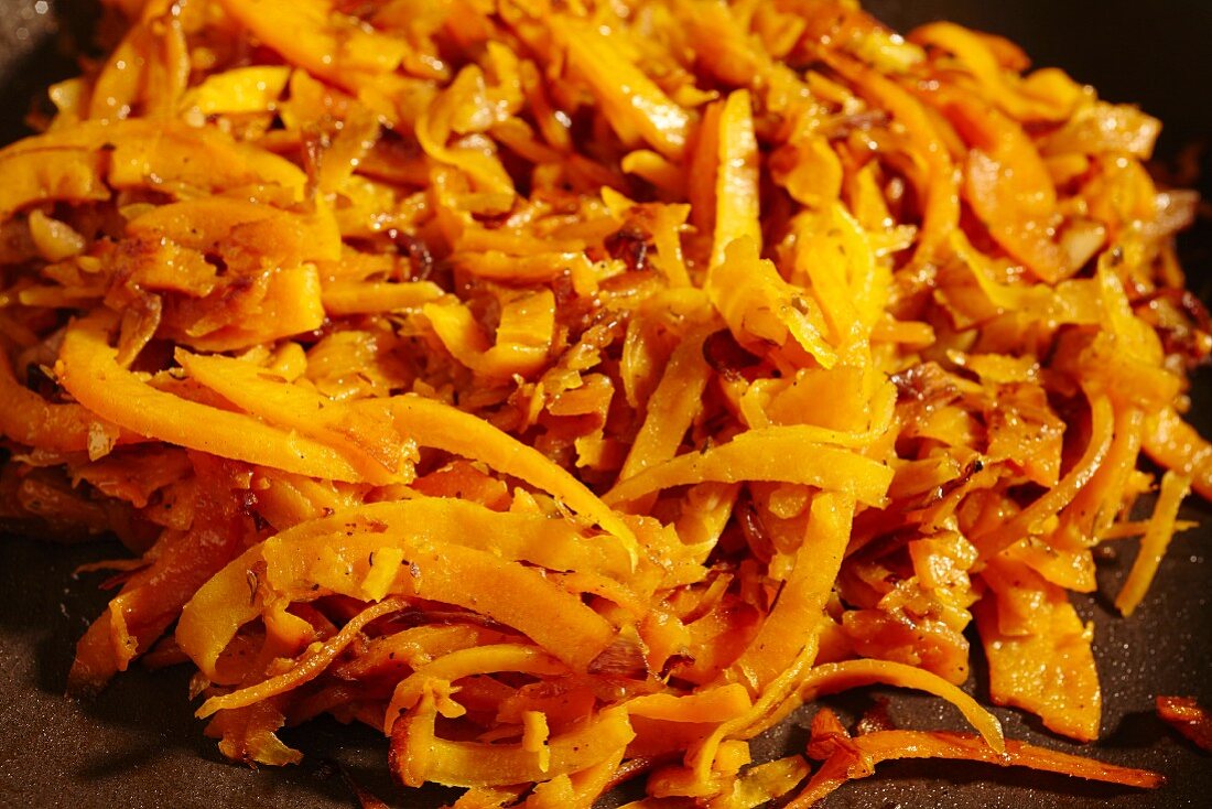 Grated butternut squash fried in olive oil with garlic and herbs