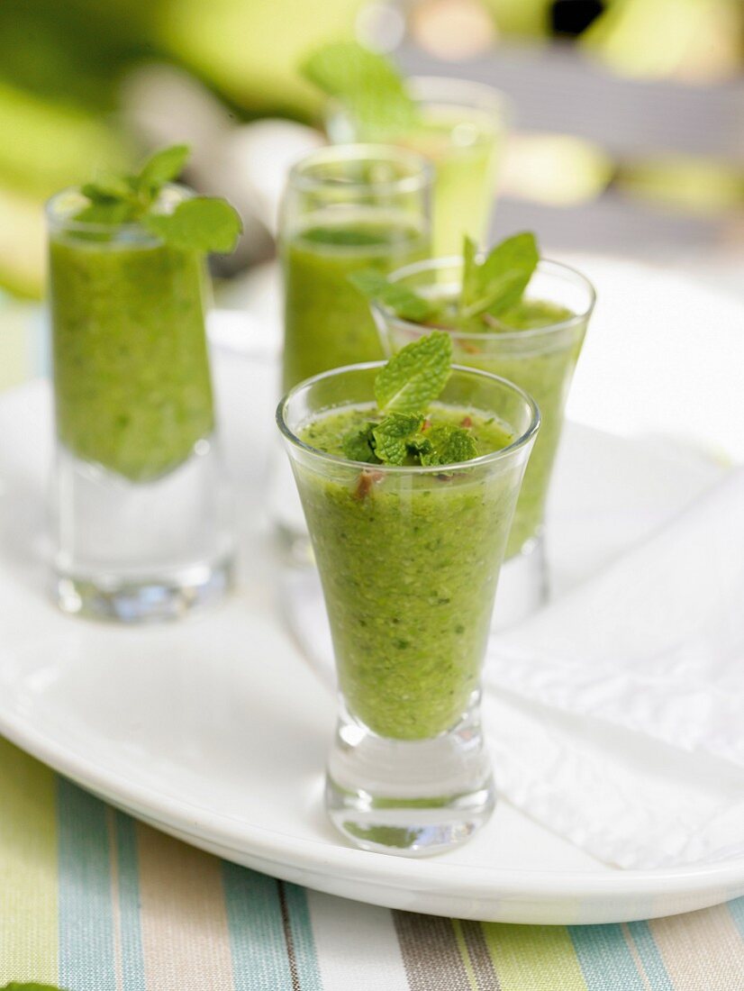 Cold pea and mint soup in shot glasses