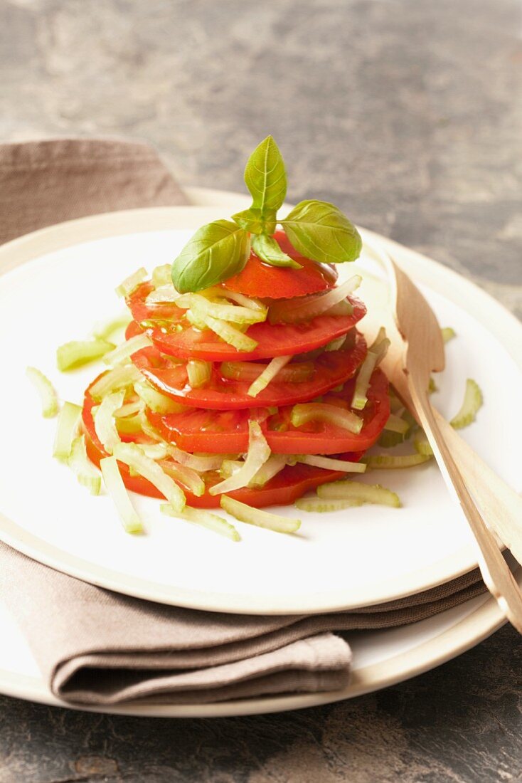 A stack of tomatoes with celery