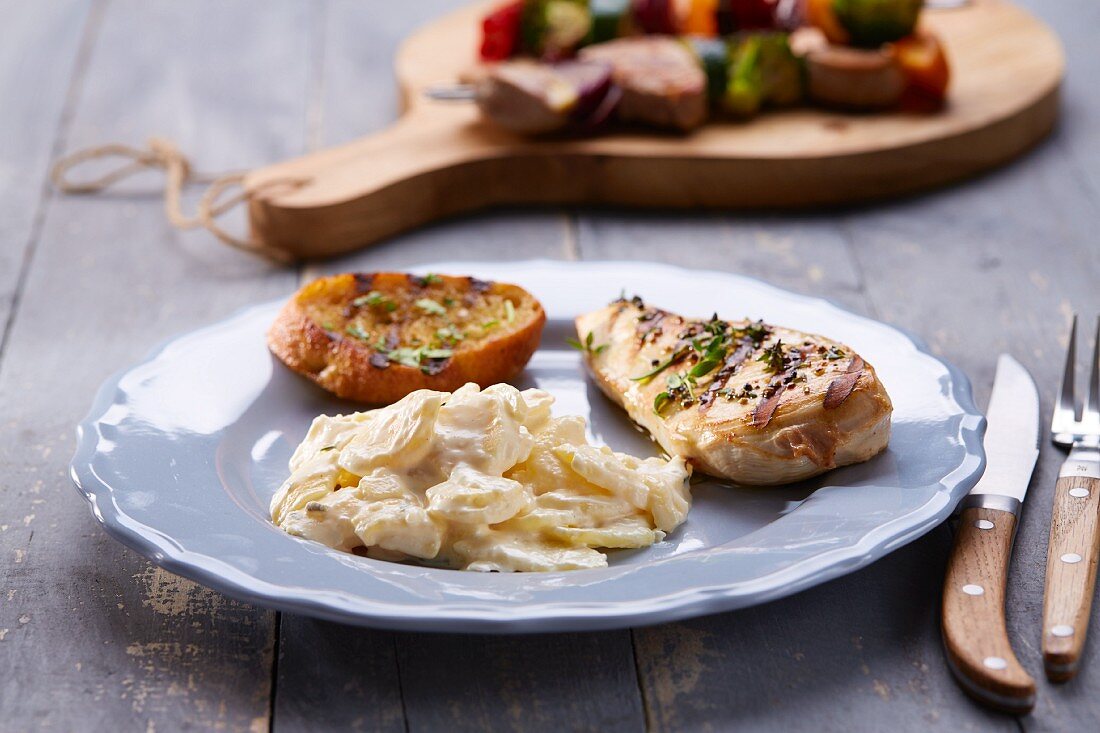 Grilled chicken breast with potato salad