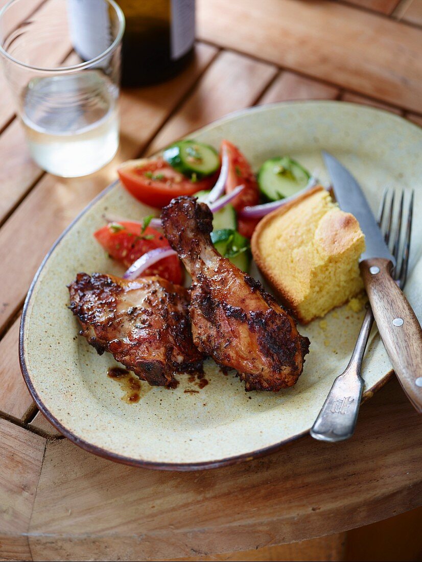 Smoked jerk chicken with corn bread and salad