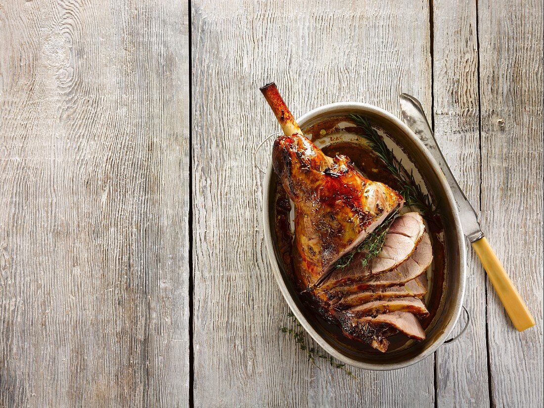 Roasted leg of lamb with ginger, honey, cider and rosemary