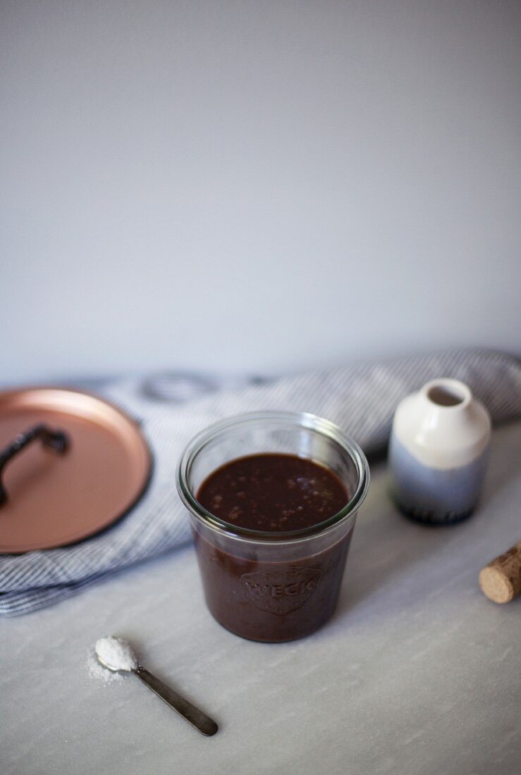 Salted chocolate fudge sauce in a glass