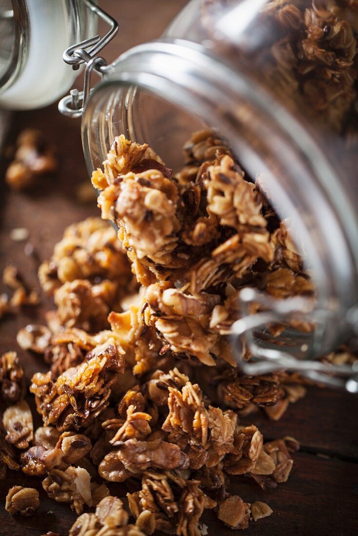 Muesli falling from a storage jar