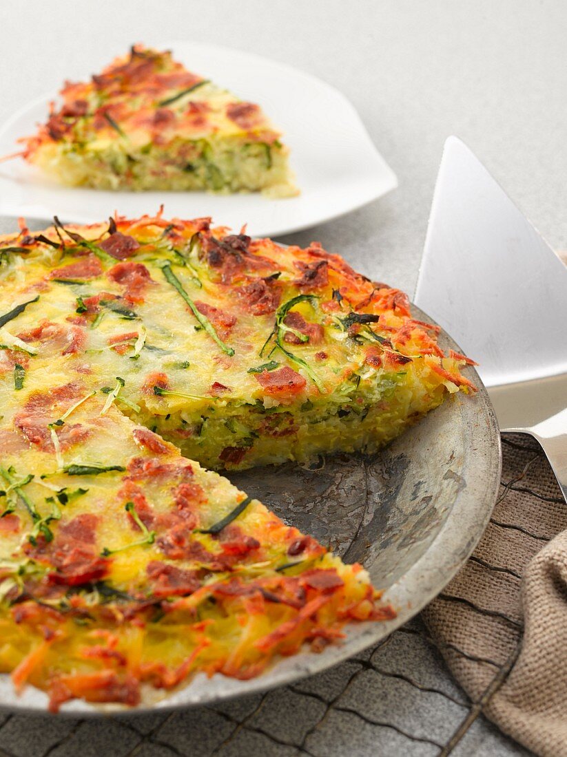 Courgette quiche with bacon, sliced
