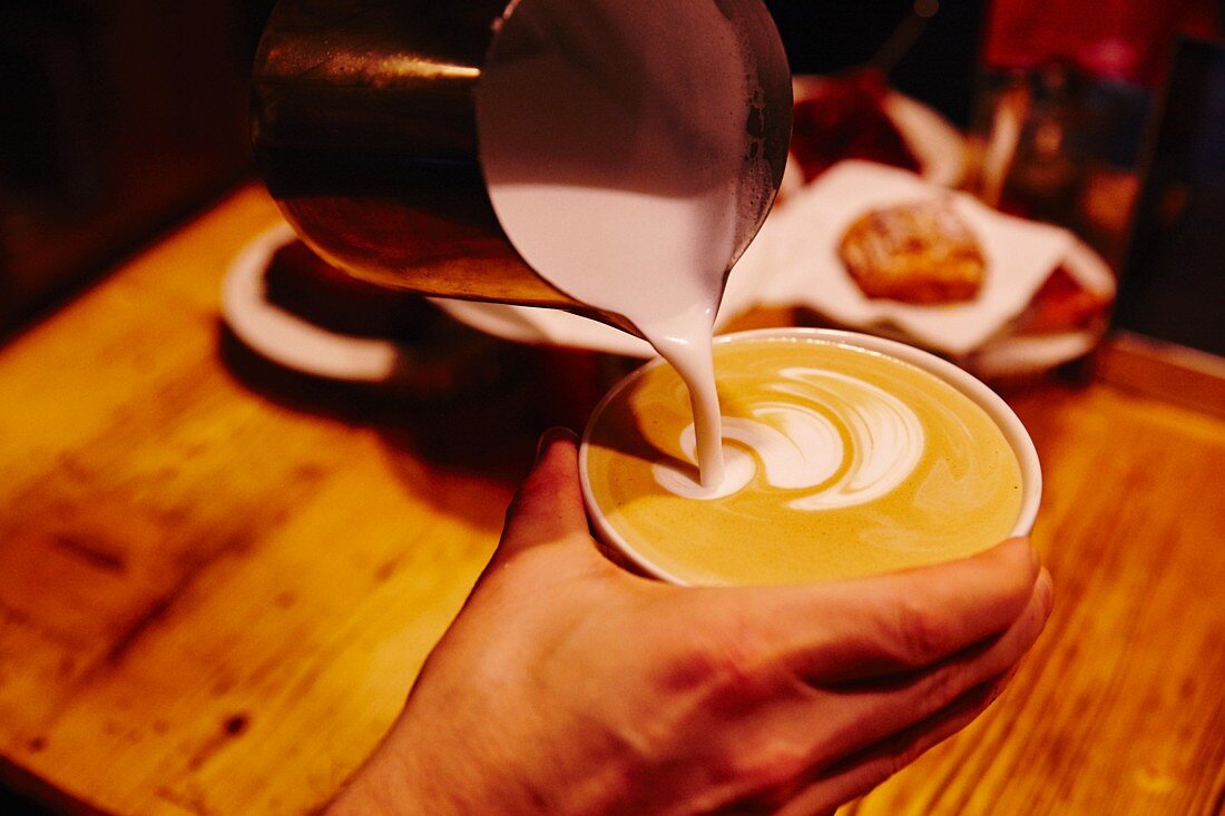 A milk pattern being made in coffee, Munich
